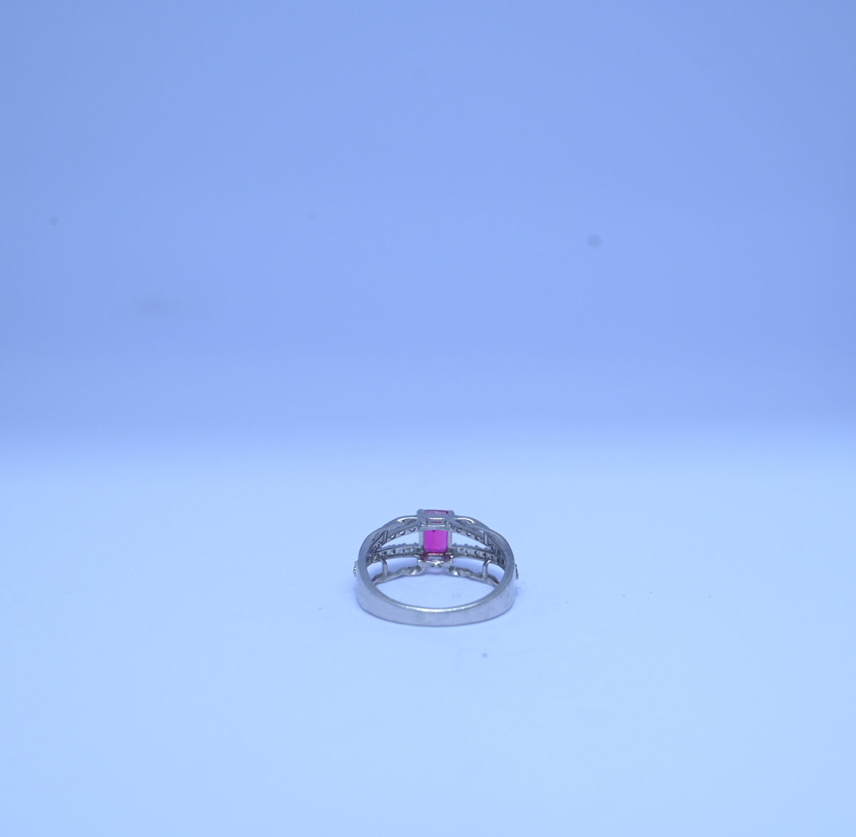 Elegant Silver-Tone Ring with Red Gemstone and Sparkling Accents - Image 2